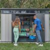 Keter Artisan 11×7 Modern Resin Outdoor Storage Shed Kit-Perfect to Store Patio Furniture, Garden Tools Bike Accessories, Beach Chairs and Lawn Mower, Grey & Black