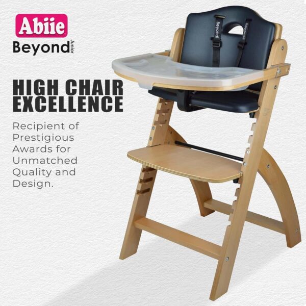 Abiie Beyond Junior Wooden High Chair with Tray. The Perfect Adjustable Baby Highchair Solution Natural Wood/Black Cushion