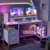 Furologee Computer Desk with Drawer and Power Outlets, 47′′ Office Desk with 2 Monitor Stands and Fabric File Cabinet, Writing Gaming Table with Shelves and 2 Hooks for Home Office, Rustic Brown